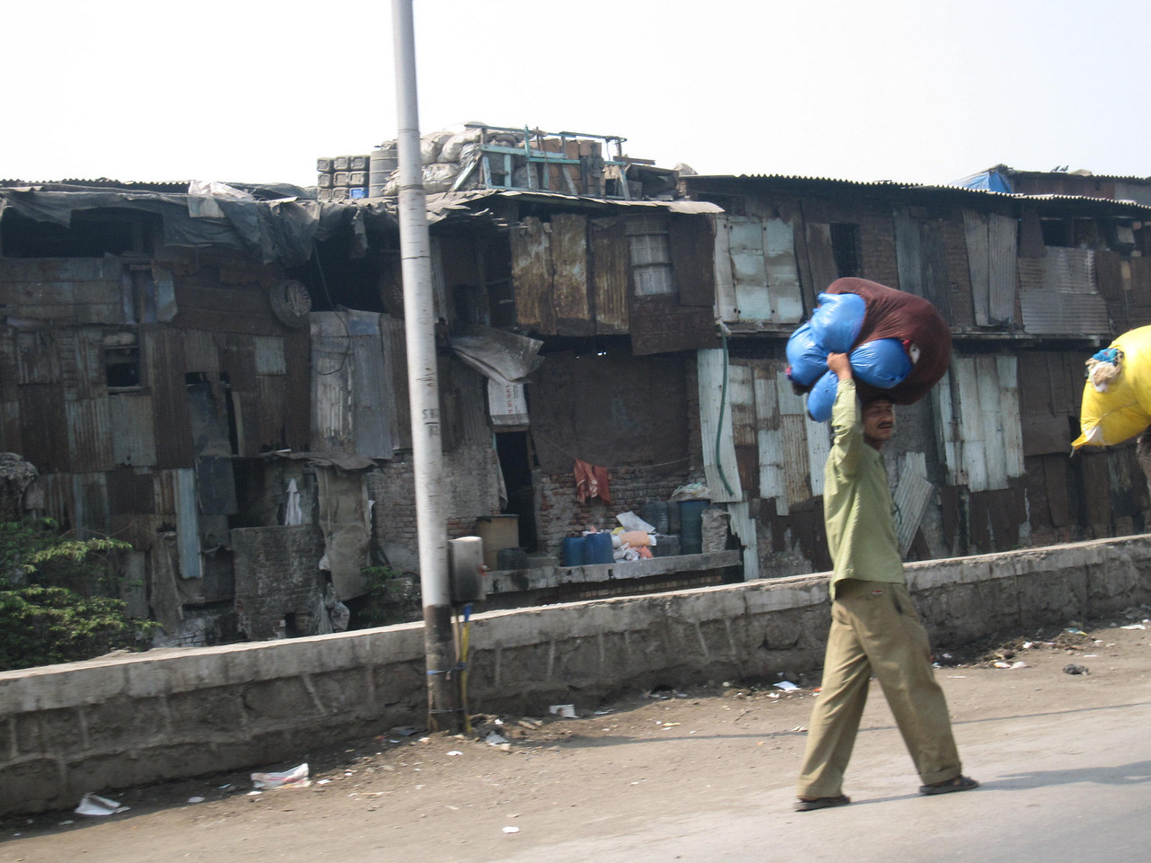 Scenes from the highway as we passed from the airport into the heart of Mumbai. mumbai airport slums culture