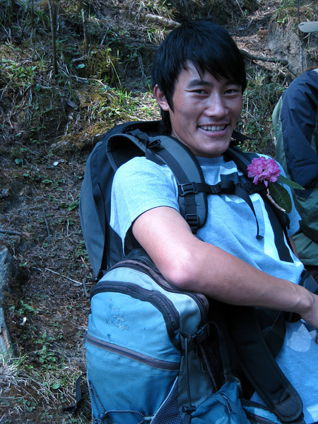 Our Porter, Nogindra, who we picked a flower for and he was always such a good sport with a good smile for us and encouragment. Our Porter on our poon hill trek