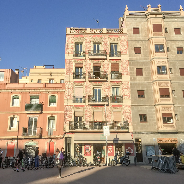 The center building is my favorite in all of Barceloneta. I love the shades of pink and delicate work on the building. Barceloneta architecture