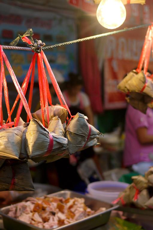 Thailand Travel Guide: Tasty street food from a festival in Chiang Mai, Thailand Food for sale at a street food market in Chiang Mai during Chinese New Year festivities.
