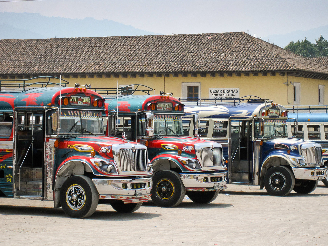 chicken buses at the centrla bus station in antigua