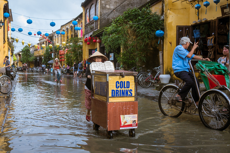 An enterprising vendor sells drinks now that the sun is shining. local street vendor in Hoi An