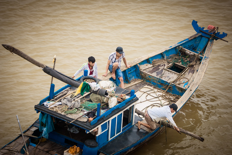 Fisherman at work in a bay near Hoi An Ancient Town. fisherman on a bay during my biking route