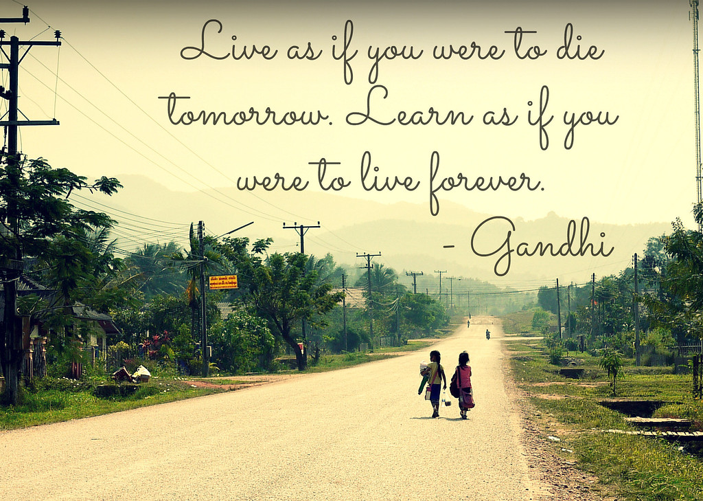 A quote by Mahatma Gandhi about learning on an image of two young school girls in rural Laos. gandhi learning quote
