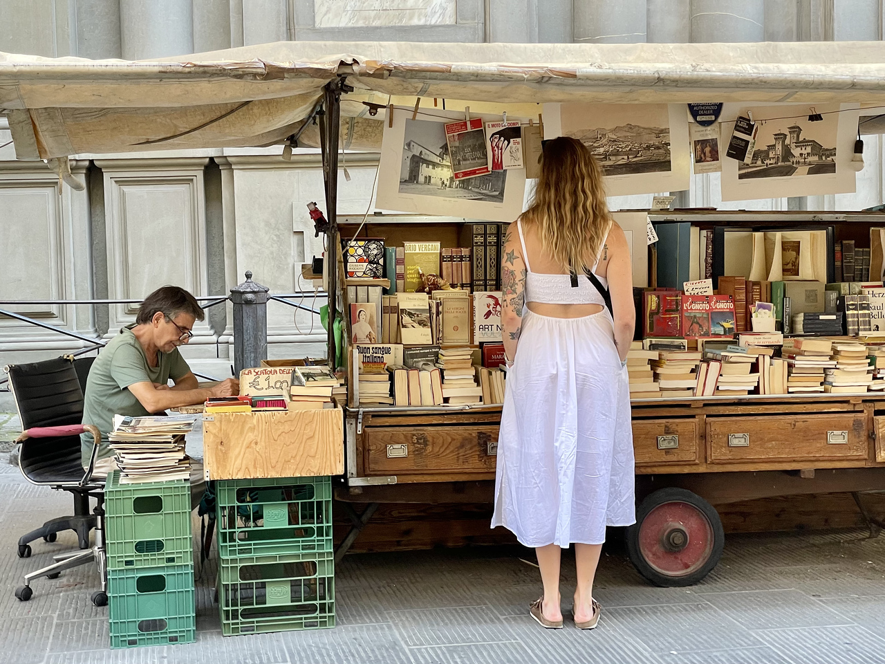 street book vendor with travel books in florence, italy