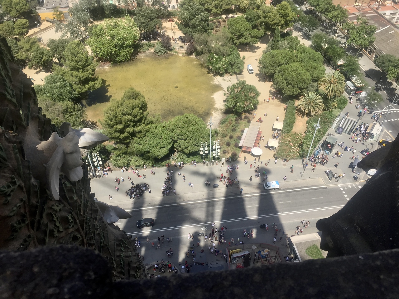 shadow of the sagrada from the tower with the park and lake nearby