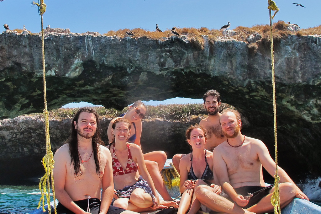Group shot on Las Marietas islands with blue-footed boobies, a day of whale watching, and relaxation on the ocean.