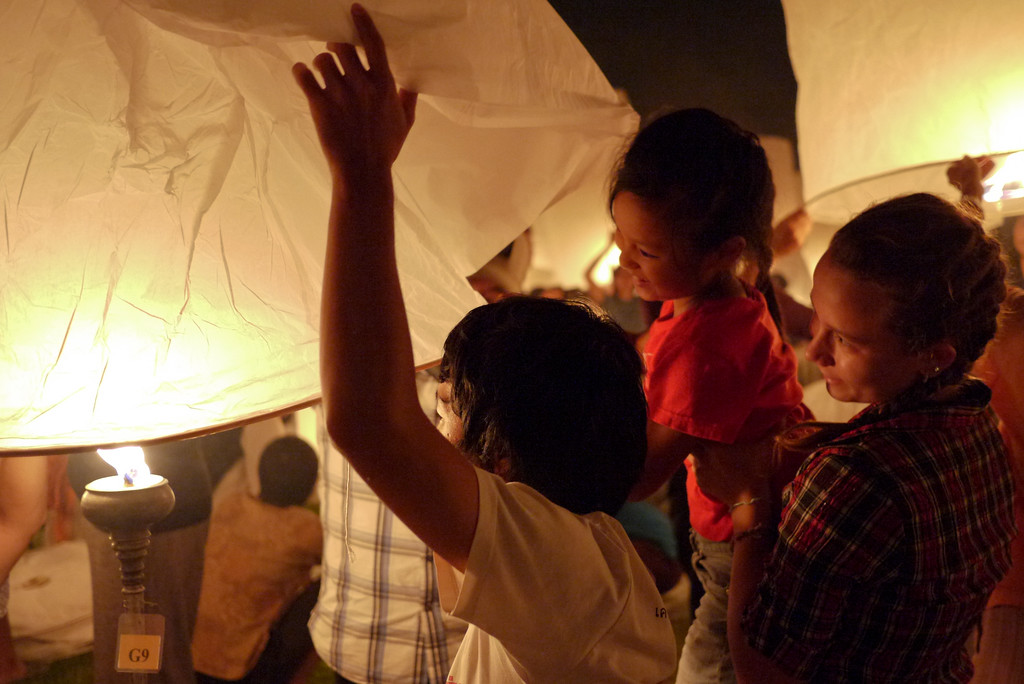 My niece and a friend partake in Loy Krathong in Chiang Mai, Thailand