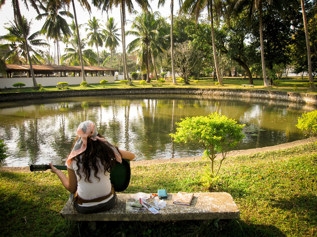 practicing guitar as locals helped her learn to play
