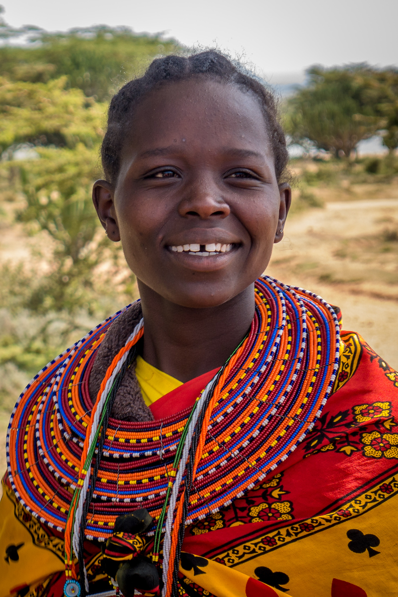Rose, one of the Maasai women helping lead our group of travelers around Maji Moto. She always had a ready smile and a full explanation to our many questions. Rose; review of Maji Moto Cultural Camp