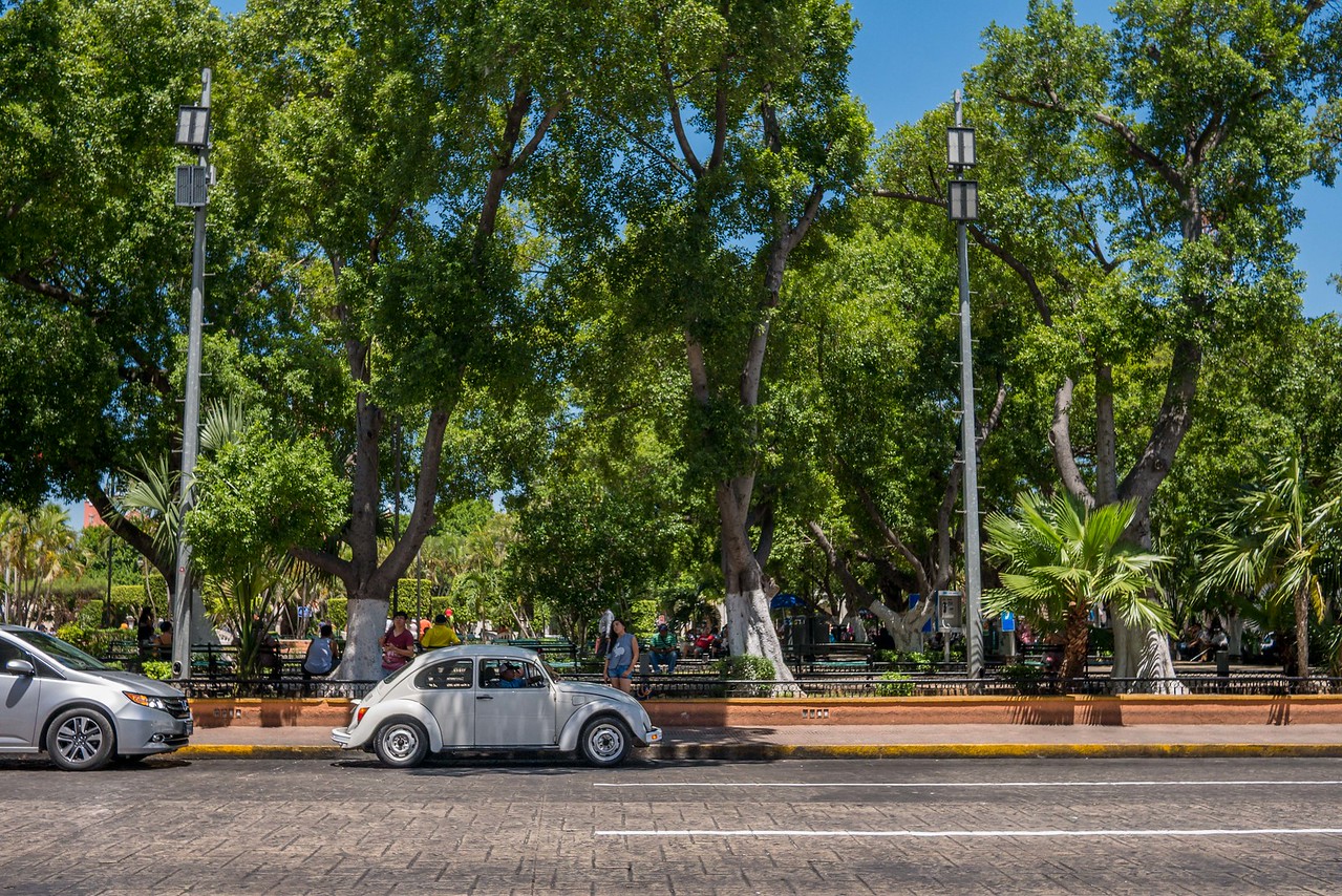plaza in Merida Mexico with a Volkswagon in front