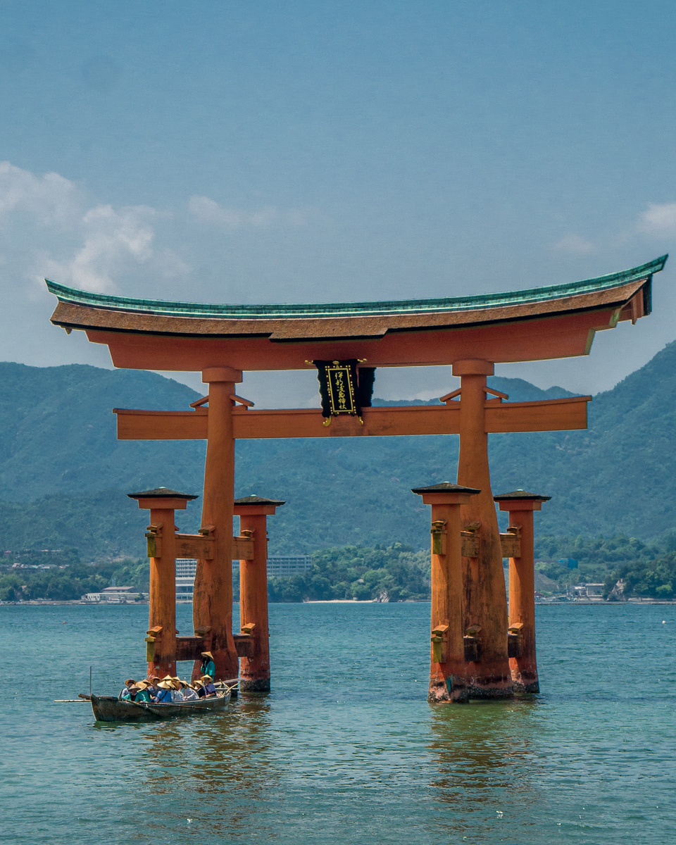 Boats motor out so that visitors can see the Itsukushima Shrine while the tide is in. Itsukushima Shrine with the tide in floating