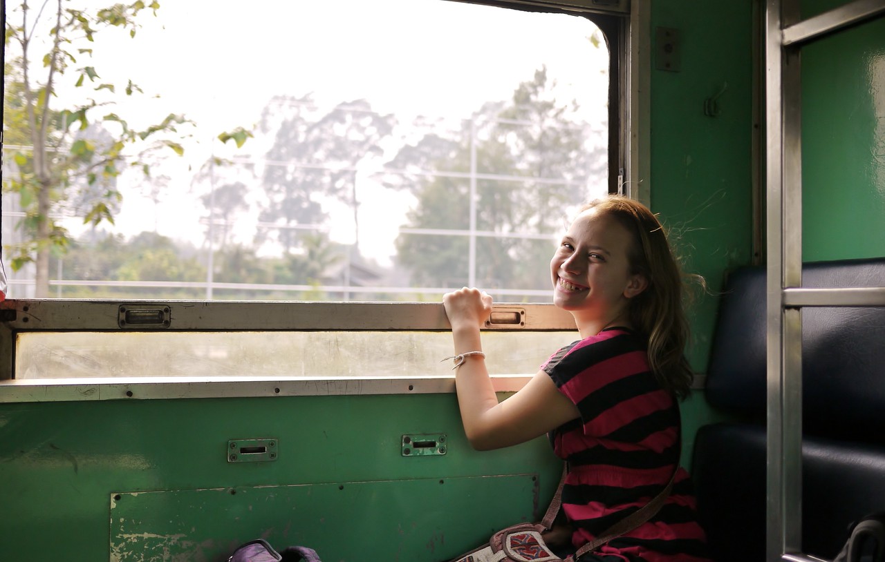 my niece Ana on a train ride as we backpacked across Thailand, Laos, and cambodia