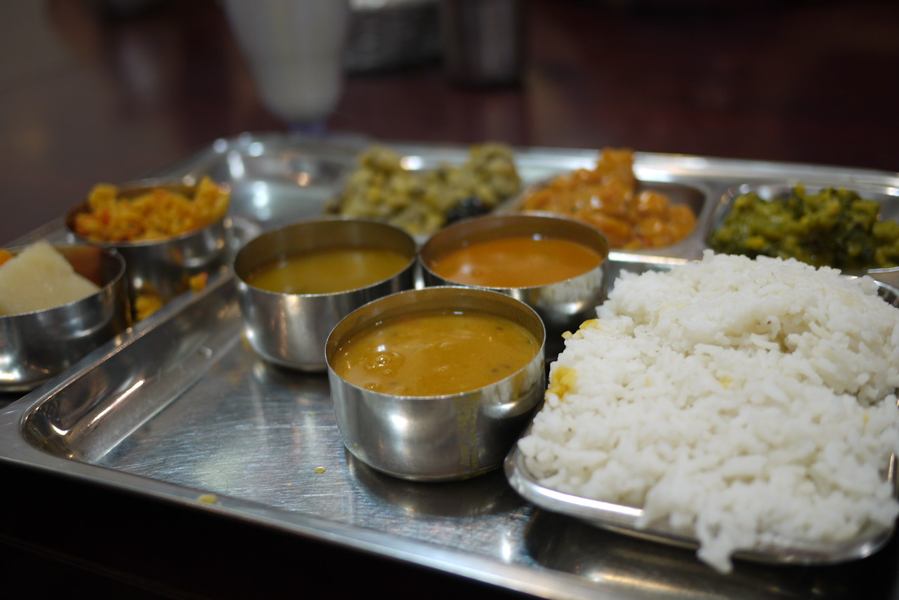 a complete meal of traditional indian food with many dishes to sample