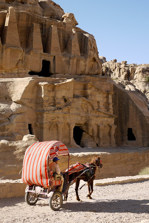 A horse-drawn carriage is a popular way for visitors to enjoy Petra, Jordan. Horse-drawn carriage, Petra, Jordan.