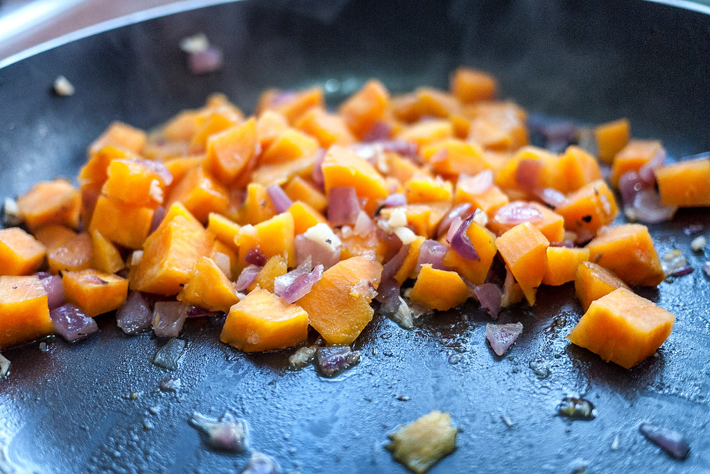 Saute the onions and cook sweet potatoes