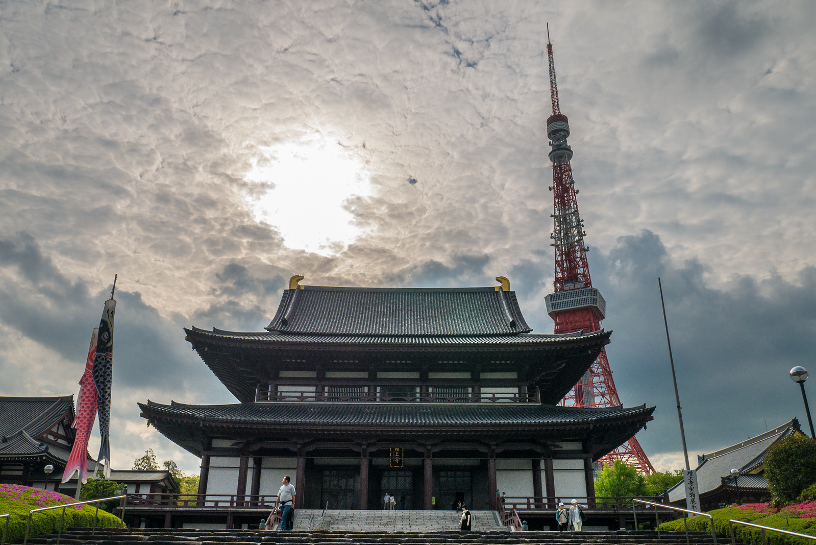 Zojo-ji Temple with the tall Tokyo Tower in the background. Zojo-ji Temple with Tokyo Temple in the background