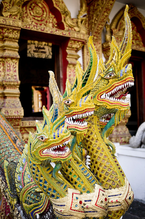 Thailand Travel Guide: Elaborately decorated dragons at a temple (wat) in Chiang Mai, Thailand. Elaborately decorated dragons at a temple (wat) in Chiang Mai, Thailand.
