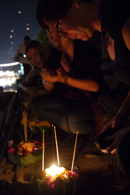 Catherine prepares her krathong for release during Loy Krathong in Chiang Mai, Thailand