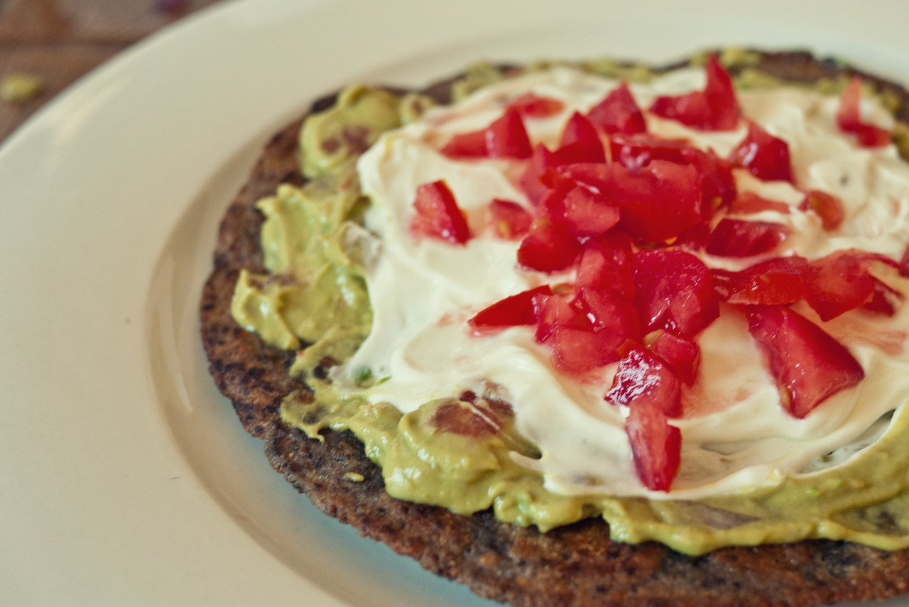 Fried tortilla with guacamole, sour cream and tomato Fried tortilla with guacamole, sour cream and tomato