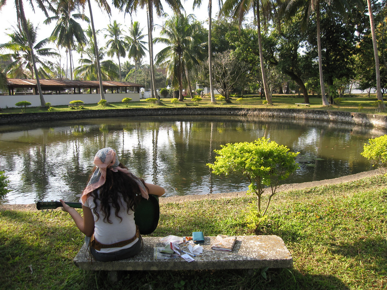 playing the guitar in Laos since we had extra time thanks to travel apps