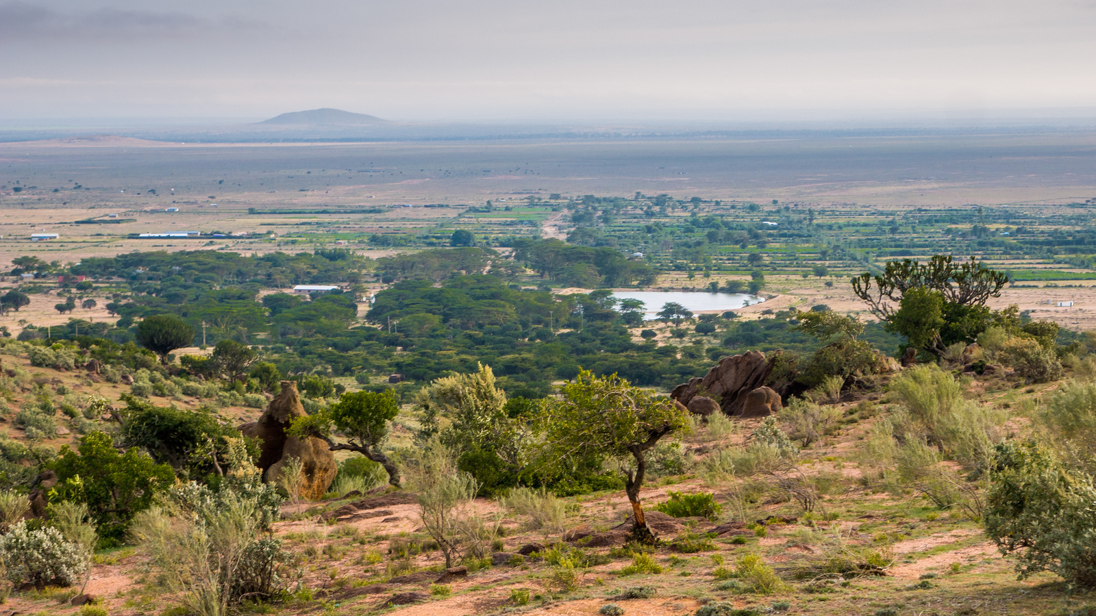 View of the Loita Hills and a high view of the Maji Moto Maasai settlement. Salaton, a Maasai chief in Kenya working to end FGM among the Maasai.