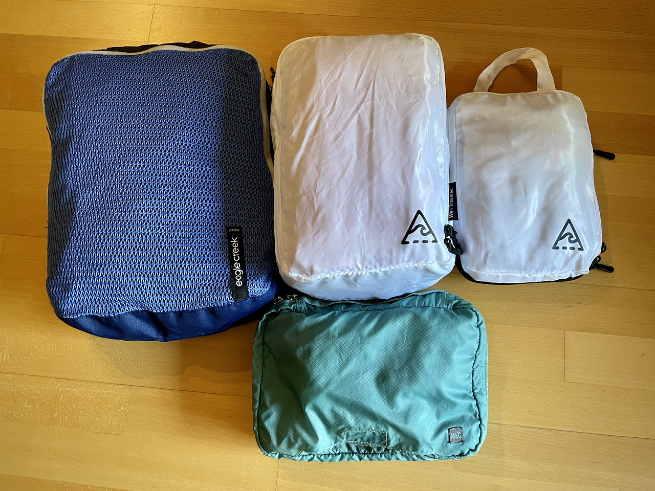 A pile of packed packing cubes